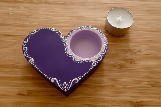 Purple and lavender heart candle holder on wood