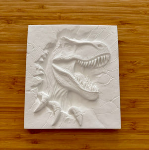 Unpainted T-Rex dinosaur plaster relief tile on wood background