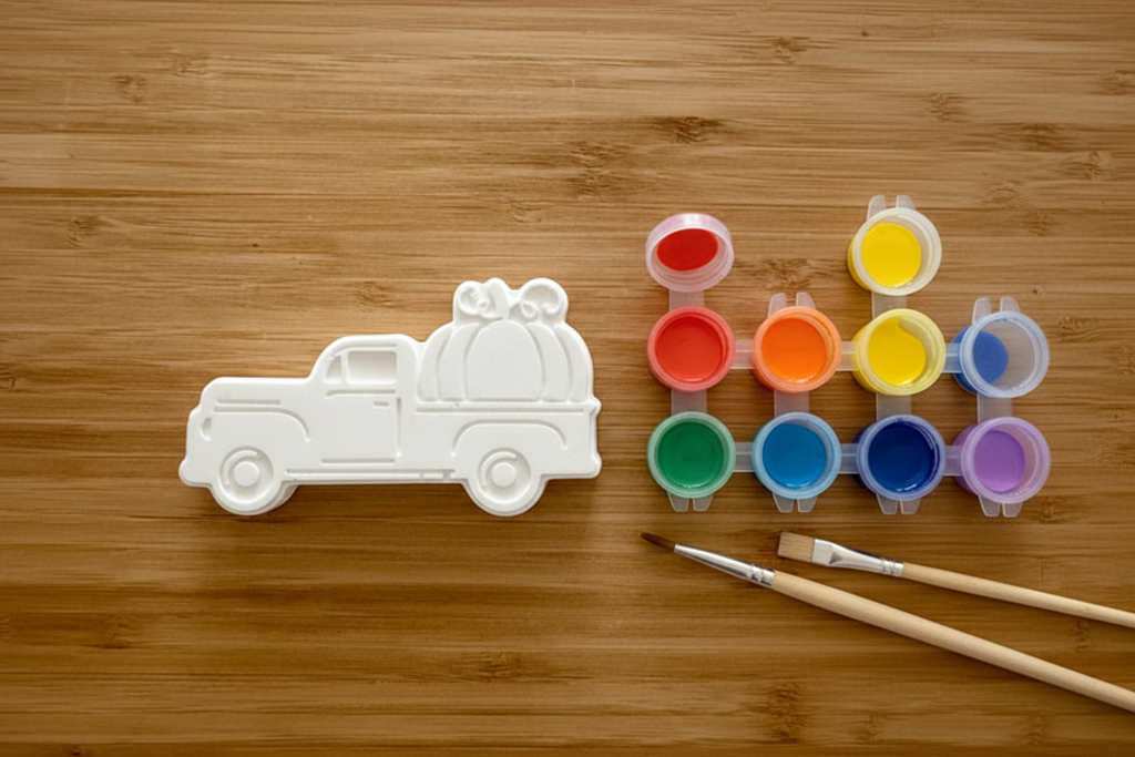 Vintage pumpkin truck with paint pots and brushes