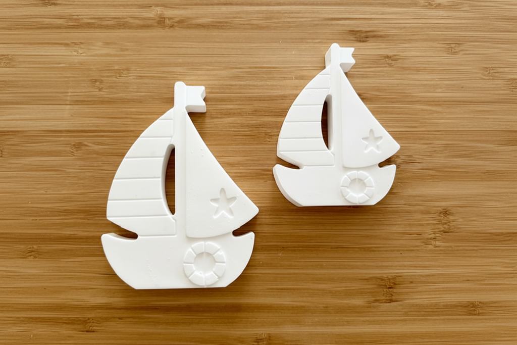 Sailboats on wood background